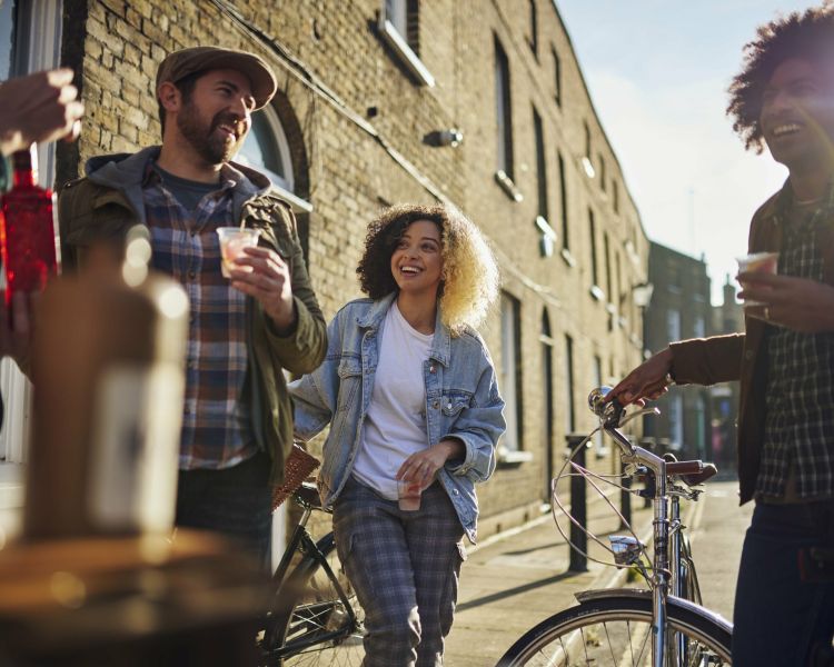 group of people enjoying a gin drink on a london gin bike tour