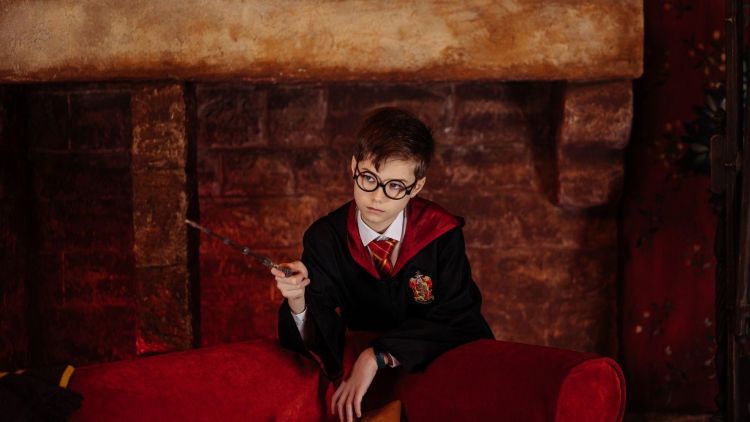 Young boy dressed as harry potter