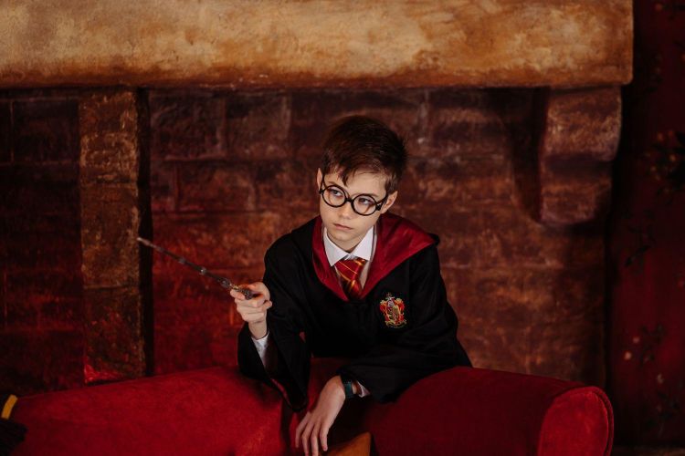Young boy dressed as harry potter