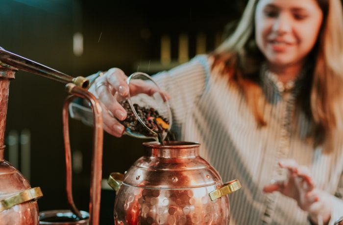 woman on gin making experience in cheltenham