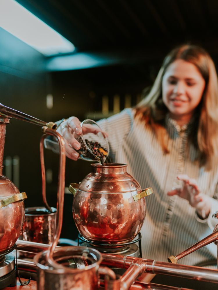 woman on gin making experience in cheltenham