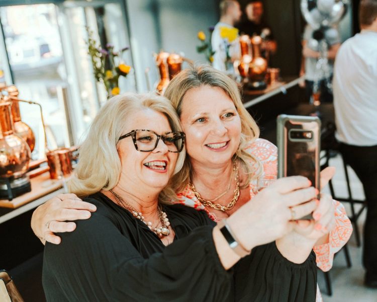 two ladies taking a selfie on a gin making experience