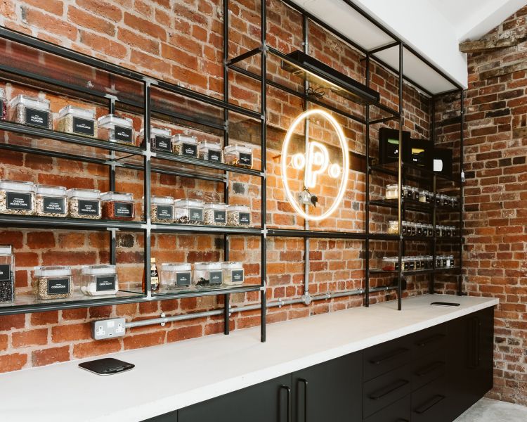 wall with boxes of ingredients seen on a gin making experience