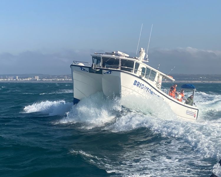 a fishing boat at sea off the coast of brighton