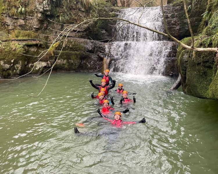 Canyoning experience in waterfall lake