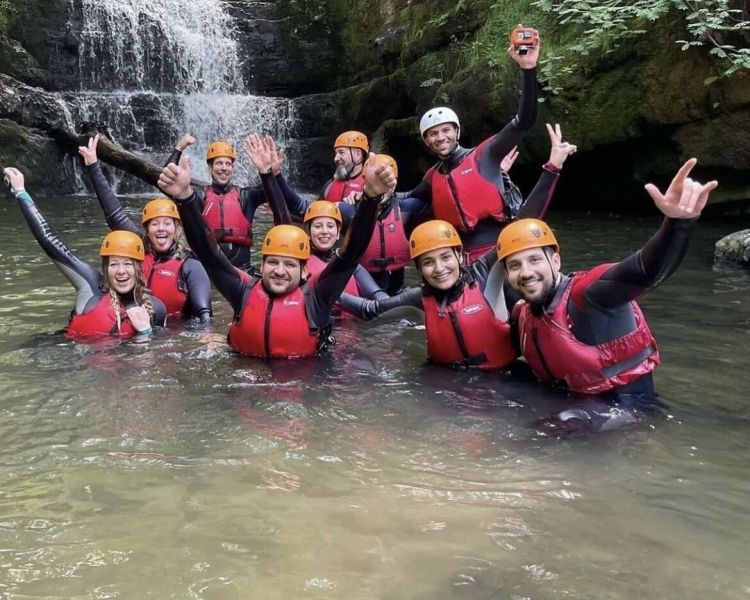 Group inside a waterfall