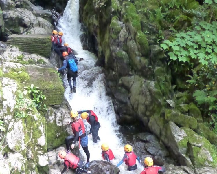 Waterfall canyoning climb