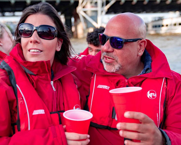 passengers enjoying a drink on a thames rocket speedboat experience in london