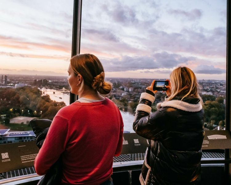 two women looking out at the london skyline from the top of lift 109