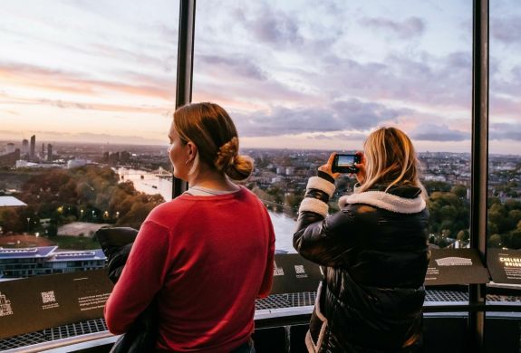 two women looking out at the london skyline from the top of lift 109