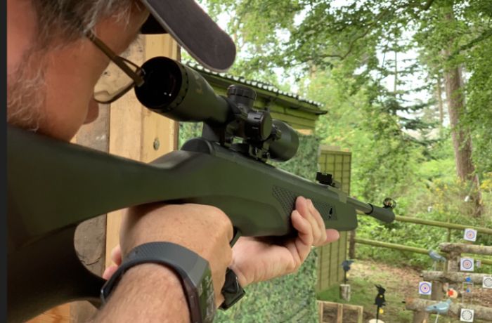 man aiming an air rifle on an air rifle experience day
