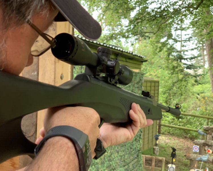 man aiming an air rifle on an air rifle experience day