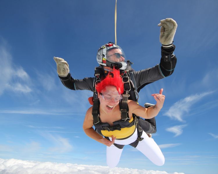a woman on a tandem skydiving experience on freefall