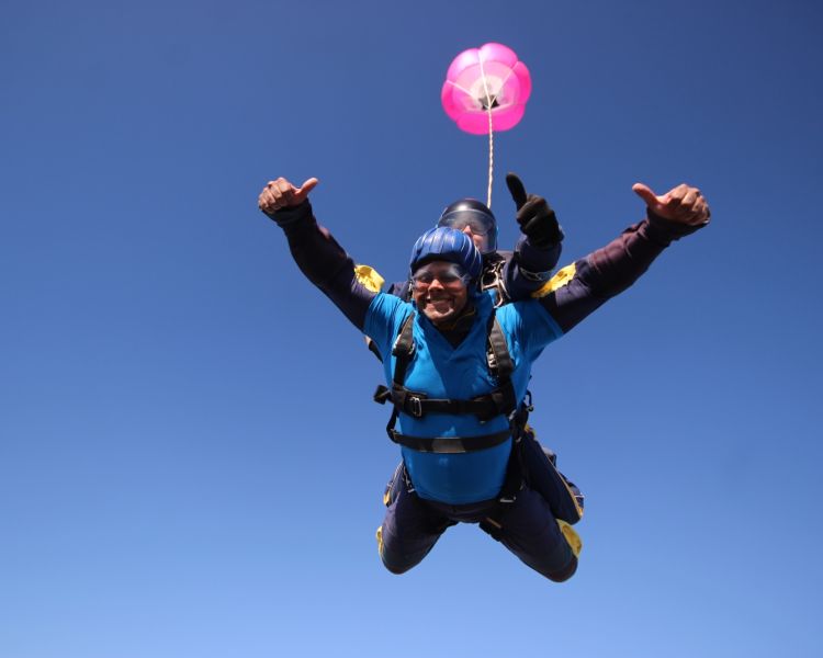 a man on a tandem skydiving experience on freefall