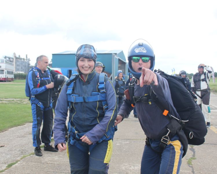 people kitted out ready for a skydiving experience