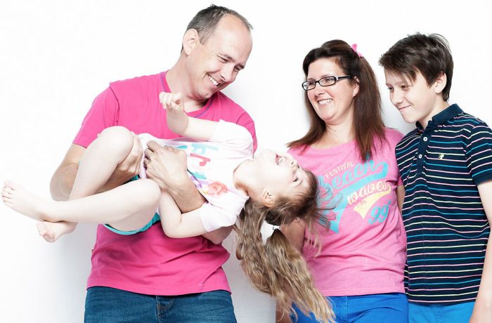 a family of four having a family photoshoot experience