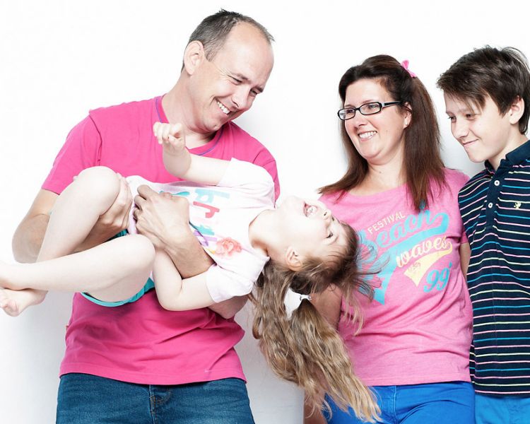 a family of four having a family photoshoot experience