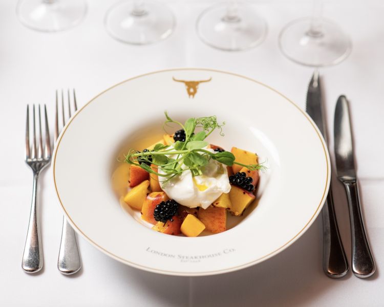 a dessert of fruit salad at marco pierre white's london steakhouse company