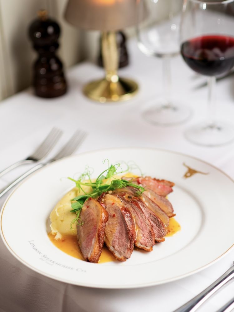 a meal of pork and mashed potato at marco pierre white's london steakhouse company