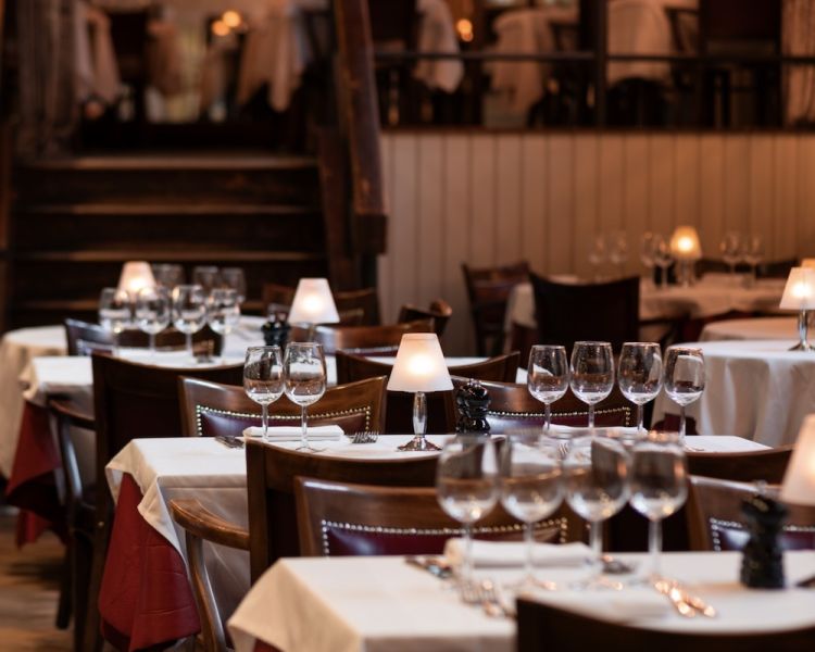 the dining area showing tables ready for diners at marco pierre white's london steakhouse company