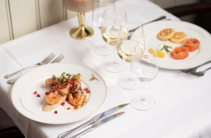 two meals laid out on a table for two at marco pierre white's london steakhouse company