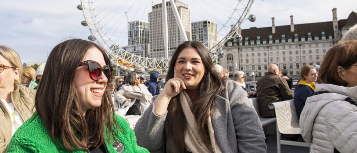 Two Guests Smiling on the London Sightseeing River Cruise