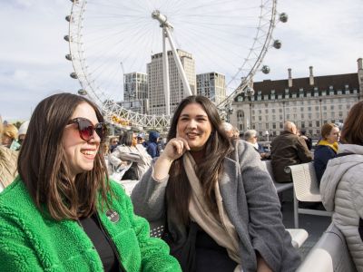 Two Guests Smiling on the London Sightseeing River Cruise
