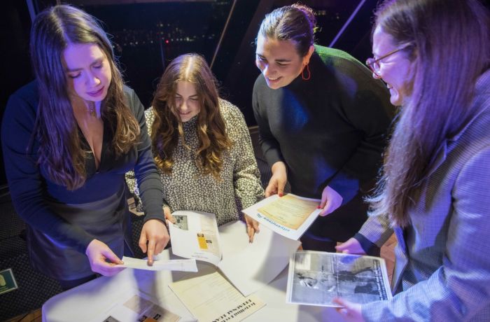 Girls Reading Clues on the Murder Mystery river cruise
