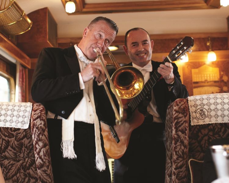 the belle house jazz band playing for passengers as they dine on the vintage northern belle train