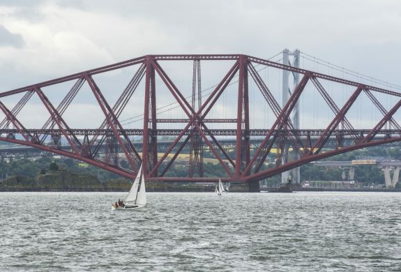 view of the forth bridges seen on a daytime sightseeing cruise in scotland