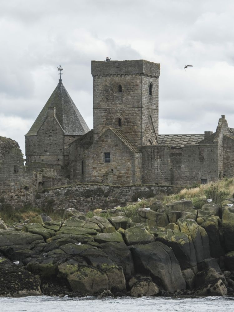 the view of an old church seen on a daytime sightseeing cruise in scotland