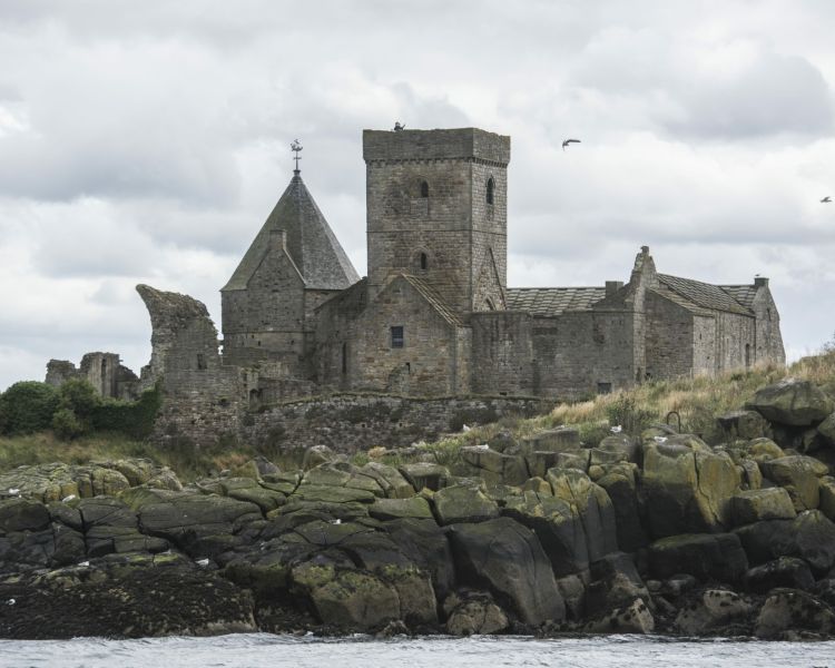 the view of an old church seen on a daytime sightseeing cruise in scotland