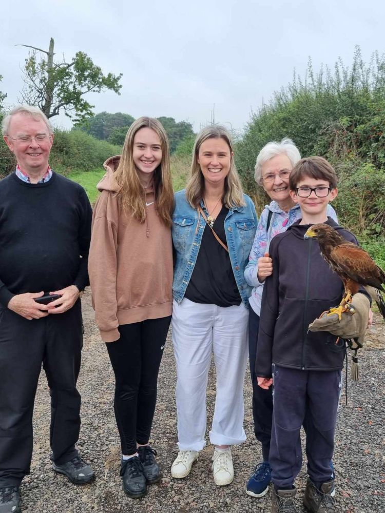 Family with young boy holding a falcon