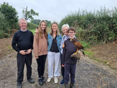 Family with young boy holding a falcon