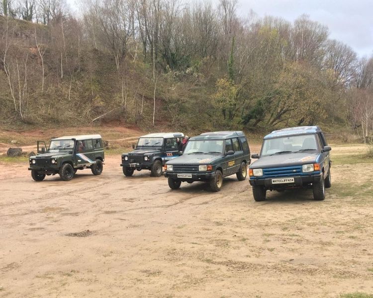 four land rover off road vehicles parked up for a driving course in gloucestershire