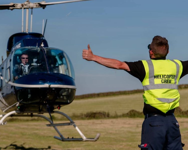 a helicopter taking off as part of a helicopter ride for 1