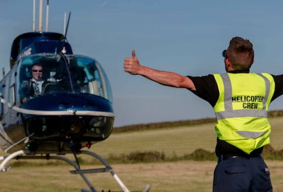 a helicopter taking off as part of a helicopter ride for 1