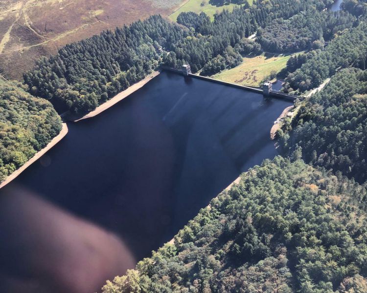 a photo of the view of a lake taken on a helicopter ride