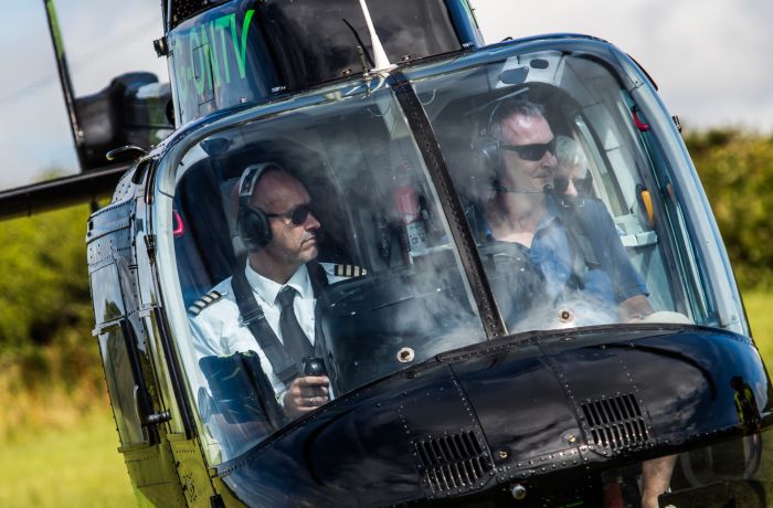 the front view of a helicopter taking off for a tour as part of a helicopter experience day