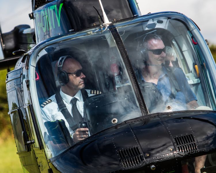 the front view of a helicopter taking off for a tour as part of a helicopter experience day