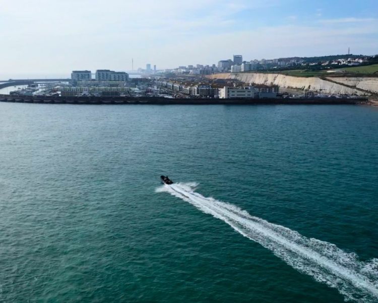 View of brighton harbour with a powerboat