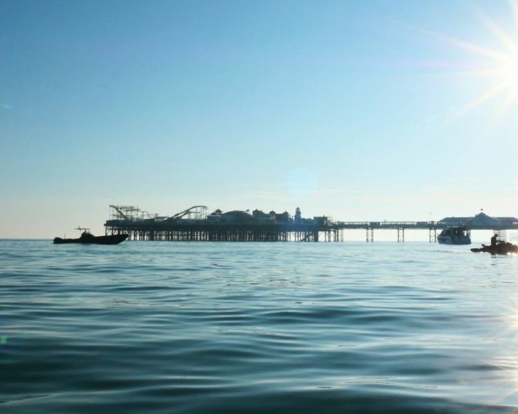 Brighton pier with speed boats