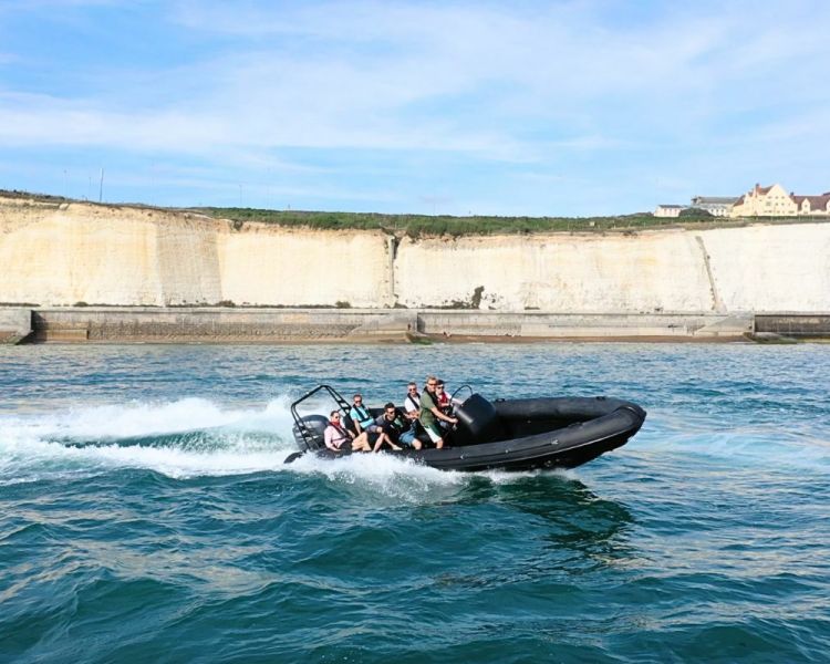People in a powerboat in the sea