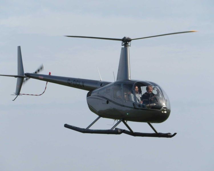 a shot of a helicopter in the sky during a helicopter flight lesson experience