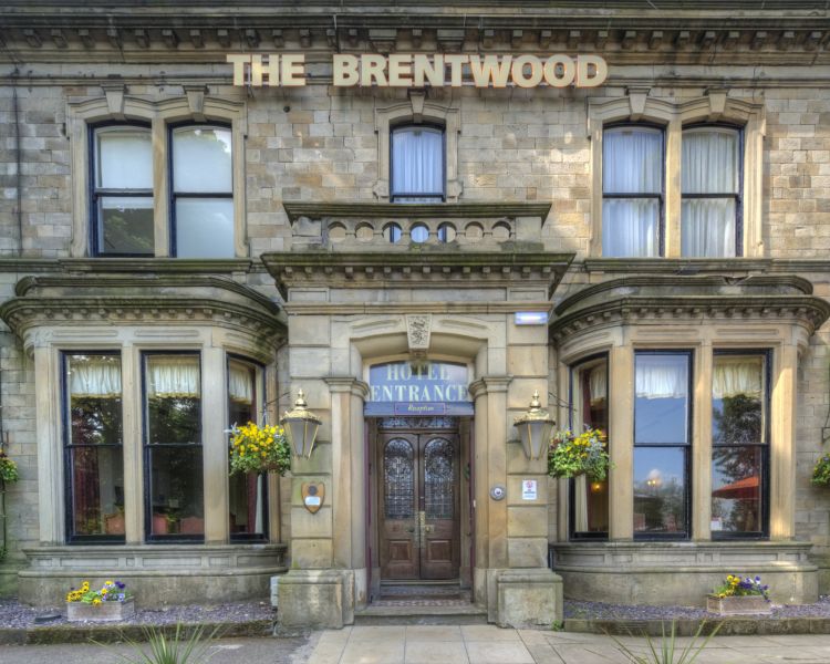 an exterior shot of the brentwood hotel in rotherham, a brick building with large windows either side of the front entrance