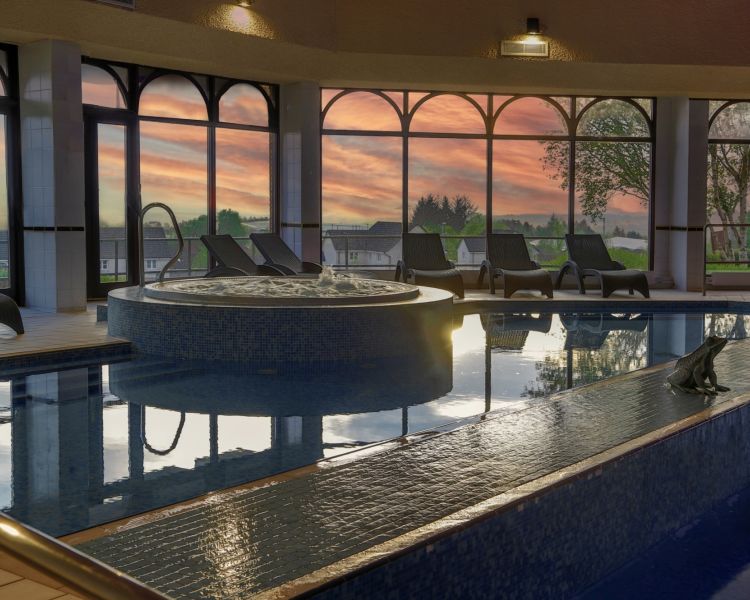 The swimming pool area with jacuzzi at the westerwood spa hotel in glasgow