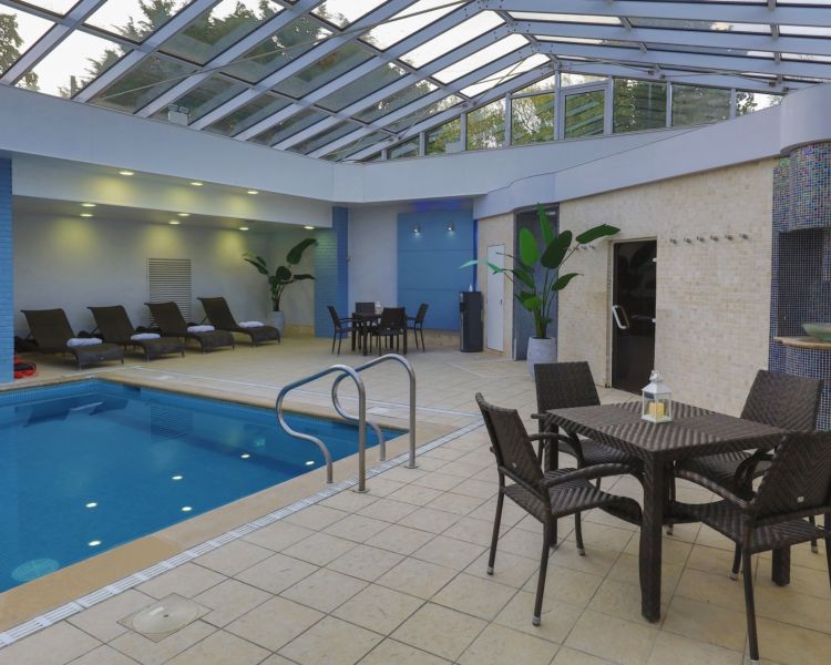 The seating area at the swimming pool of the spa hotel in oxford
