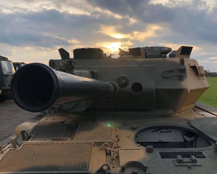 a close up of the front of a scorpion firing tank on a driving experience day