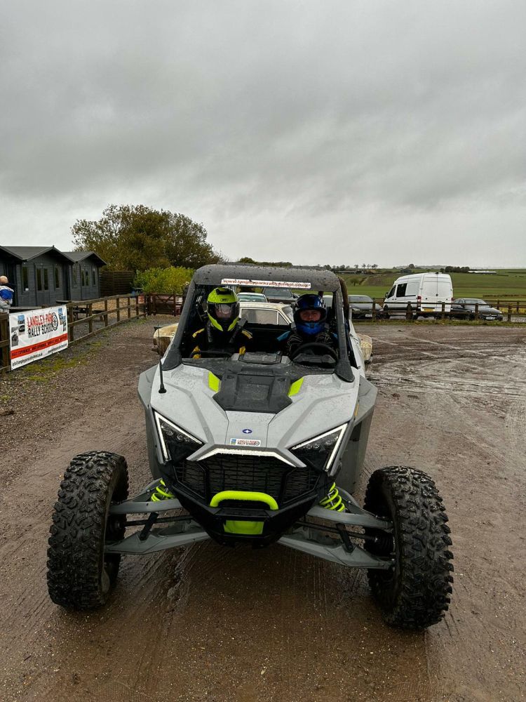 the polaris rzr turbo r buggy on a gravel track ready for a driving experience