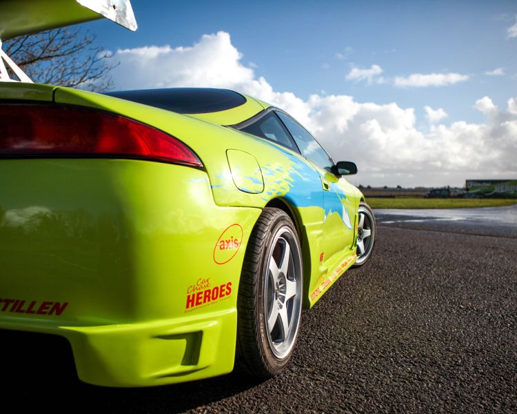 lime green sports car on a race track for a driving experience day